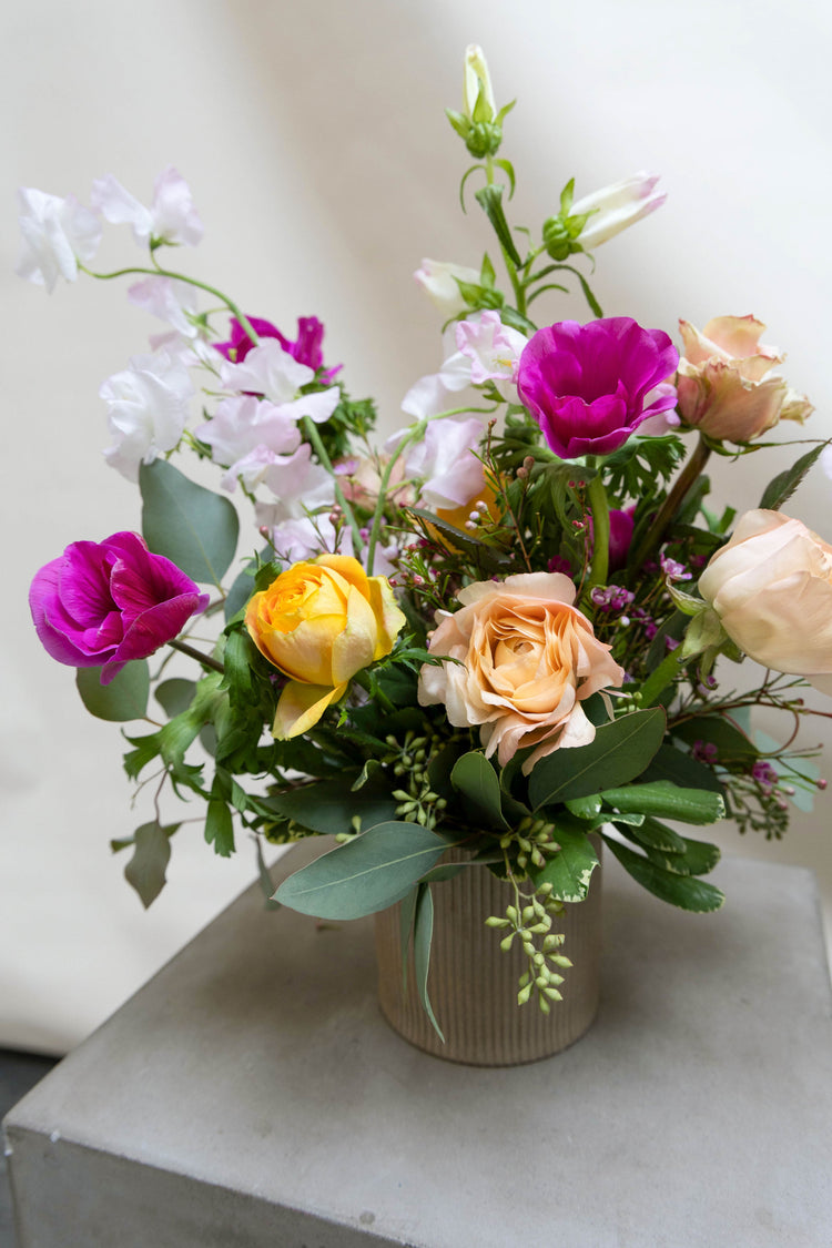 Fuchsia and yellow flower arrangement.