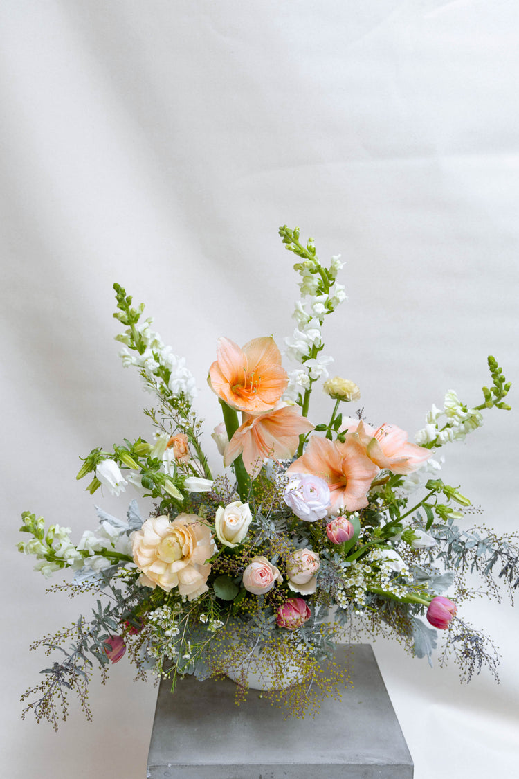 Peach and white floral arrangement.