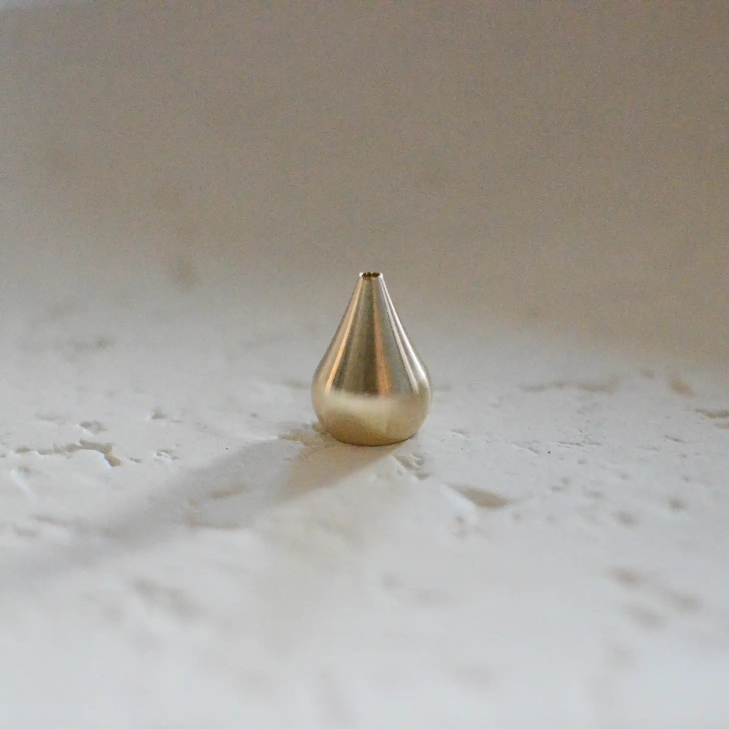 Small brass incense holder with pinched top