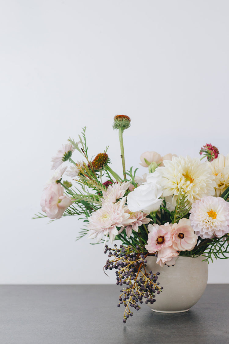 Small flower bouquet in light pink tones.