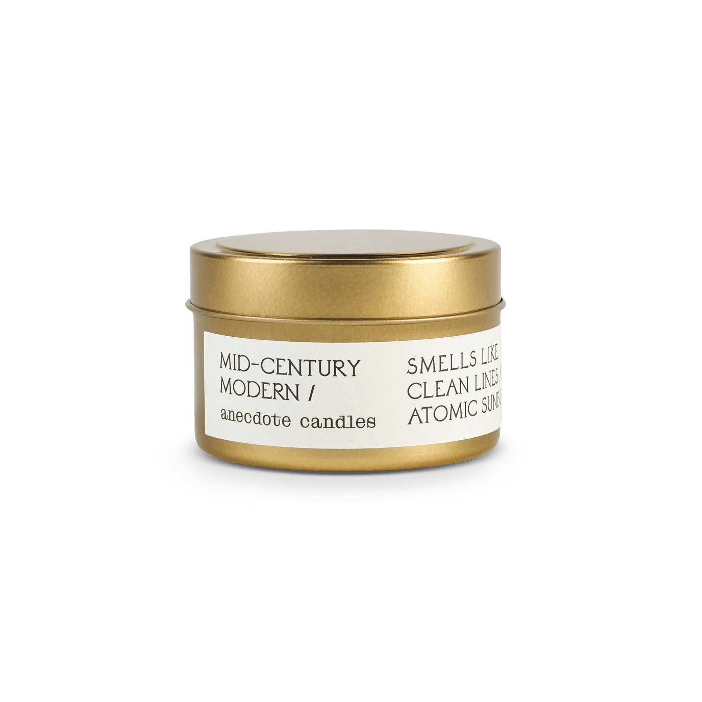 Small candle with label reading Mid-century modern.