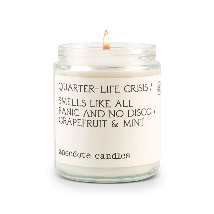 Candle with label reading Quarter-life crisis / Smells like all panic and no disco. / Grapefruit and mint