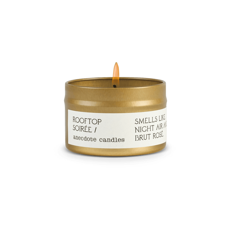 Candle with label that reads Rooftop soiree.